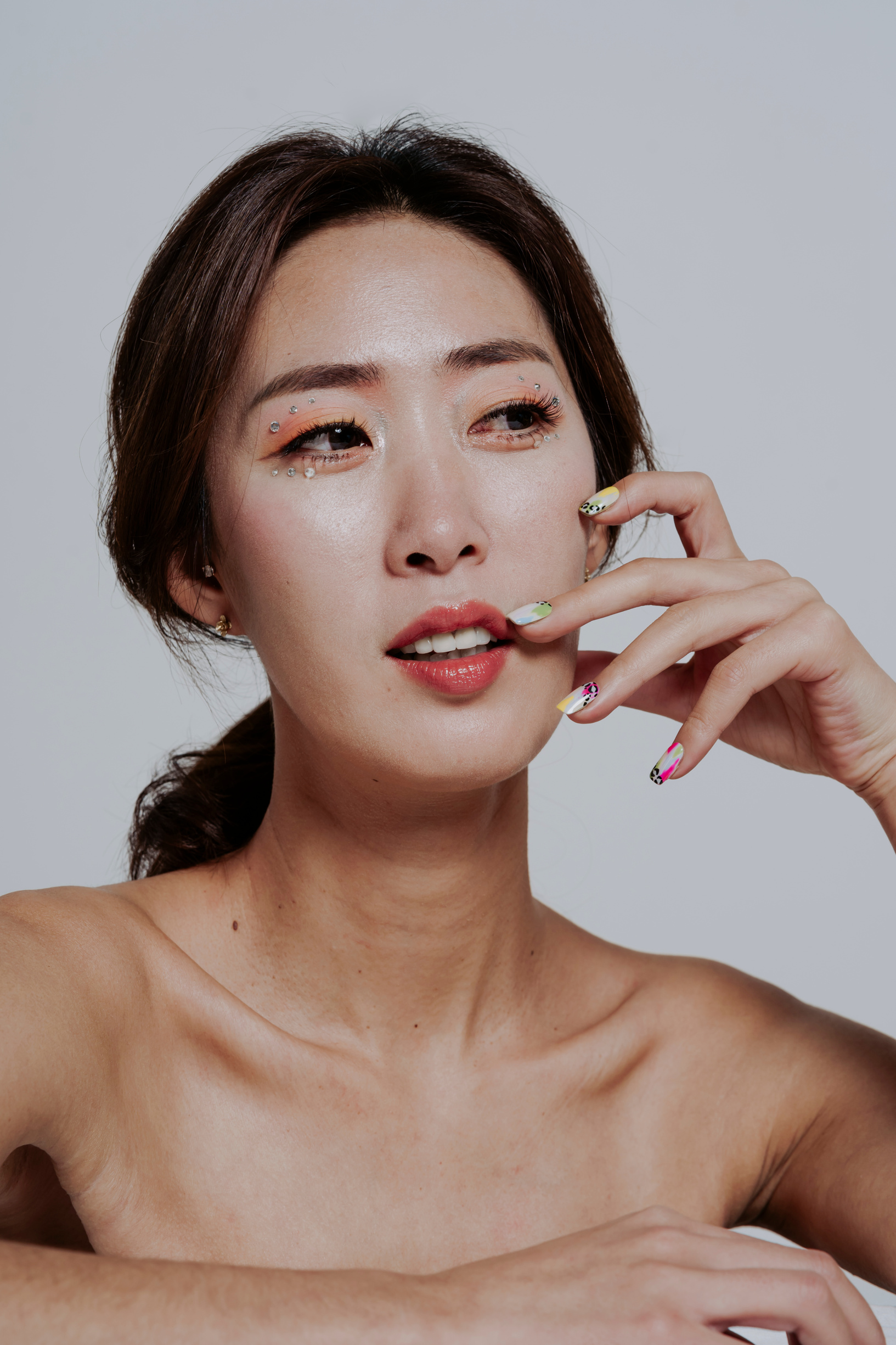 Woman with Makeup Showing Nail Art